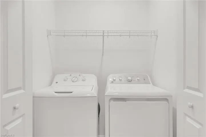 Clothes washing area with washer and clothes dryer