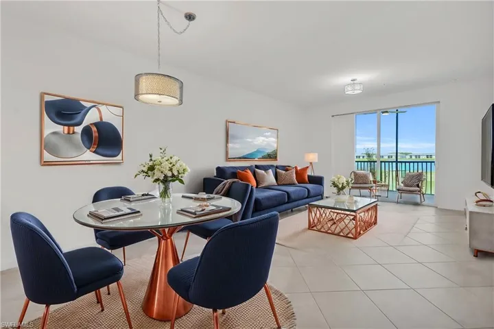 Dining area with light tile patterned floors