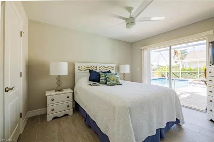 Guest bedroom with sliders to the pool area