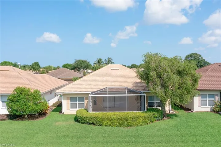 Rear view of house featuring a lanai and rear yard --- room for a pool!