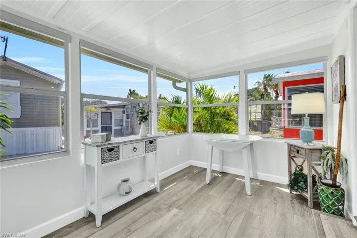 Enclosed porch offers additional space to relax or entertain!