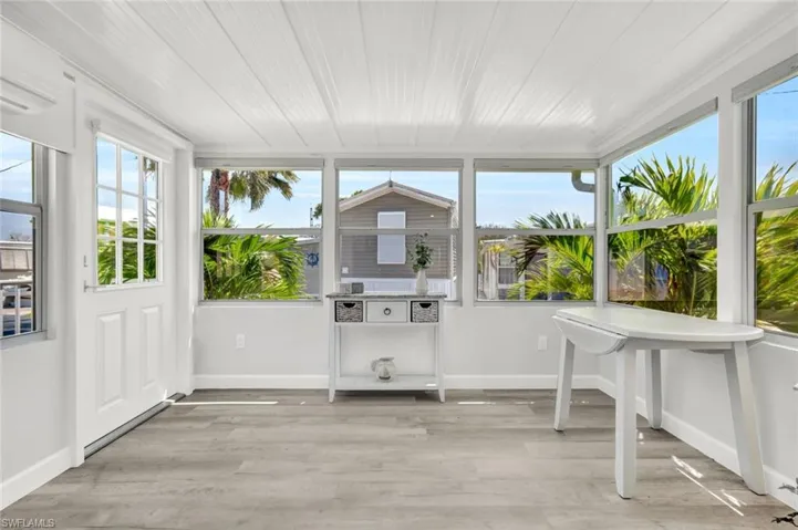 Enclosed porch offer outdoor access.