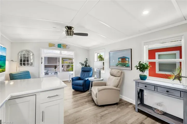 Notice the vaulted ceiling and luxury vinyl flooring throughout....
