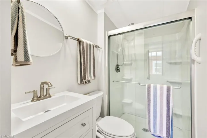Bathroom features a walk-in shower.