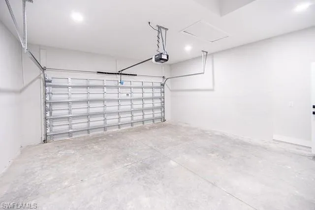Garage featuring a garage door opener