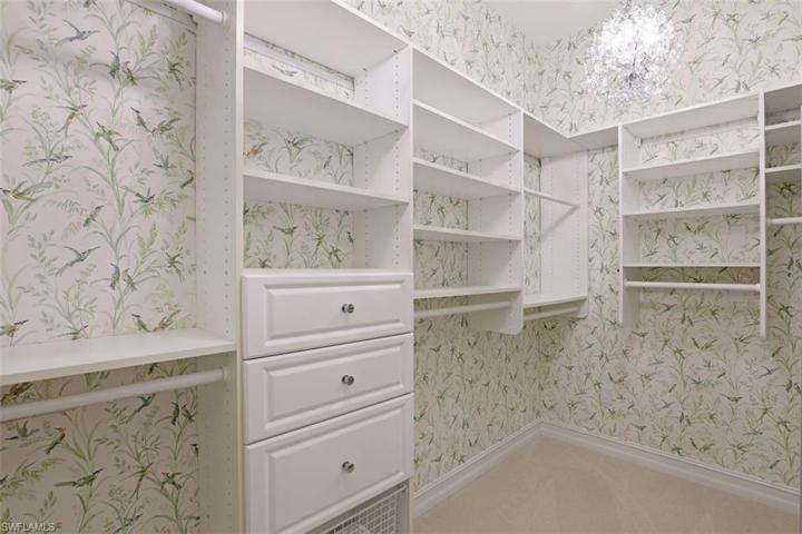 Two large walk-in closets w/ custom built-ins