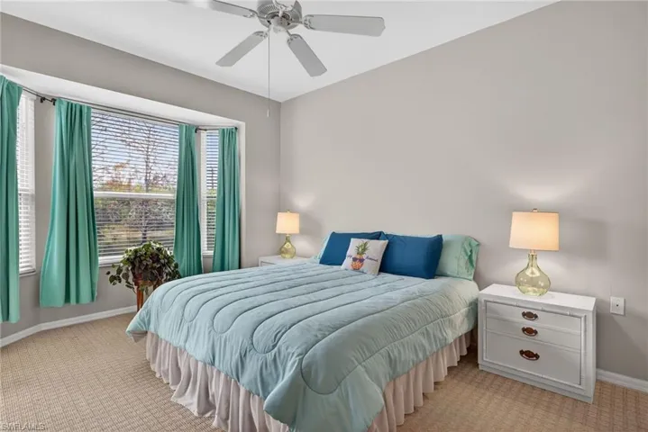 Bedroom featuring carpet flooring and a ceiling fan