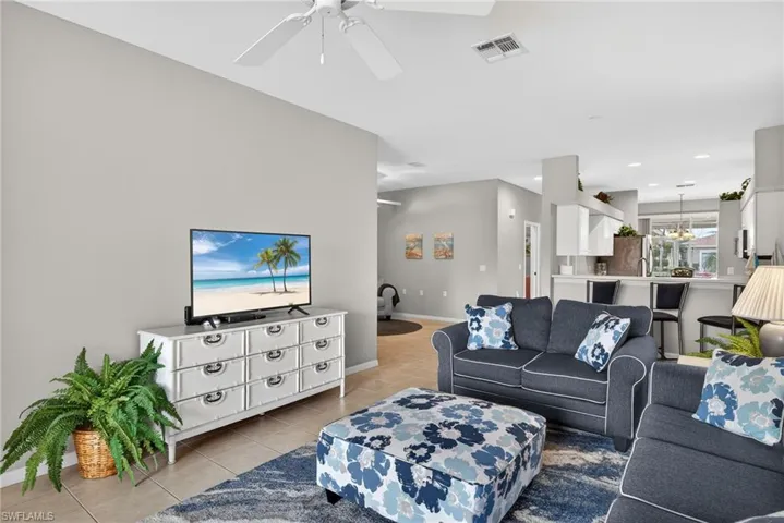 Living room featuring light tile patterned flooring and baseboards