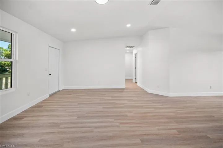 Unfurnished room featuring light wood-style flooring and recessed lighting