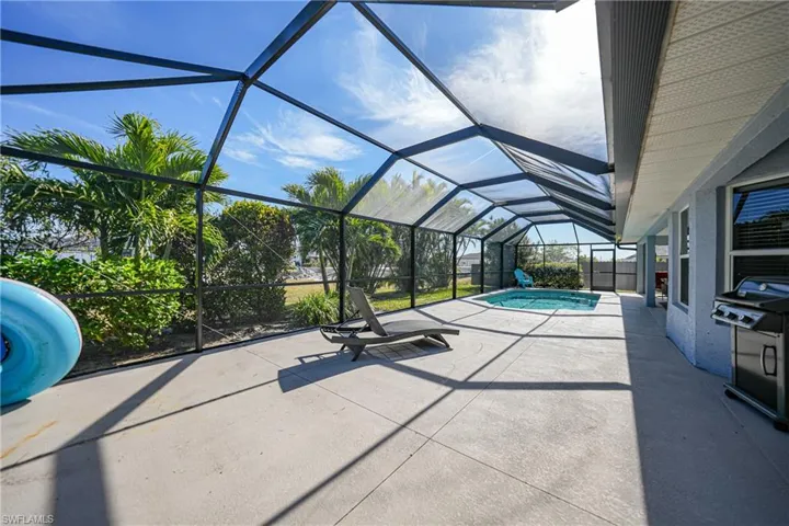 View of pool featuring a patio and a lanai