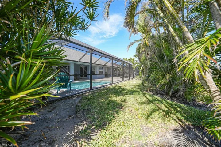 View of yard featuring a lanai
