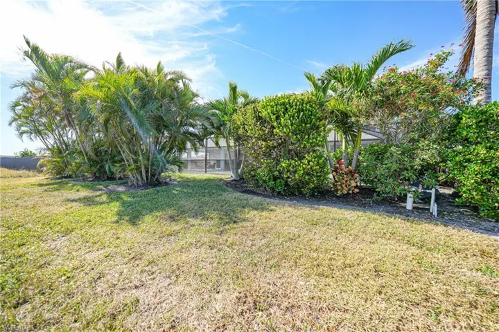 View of yard with a lanai