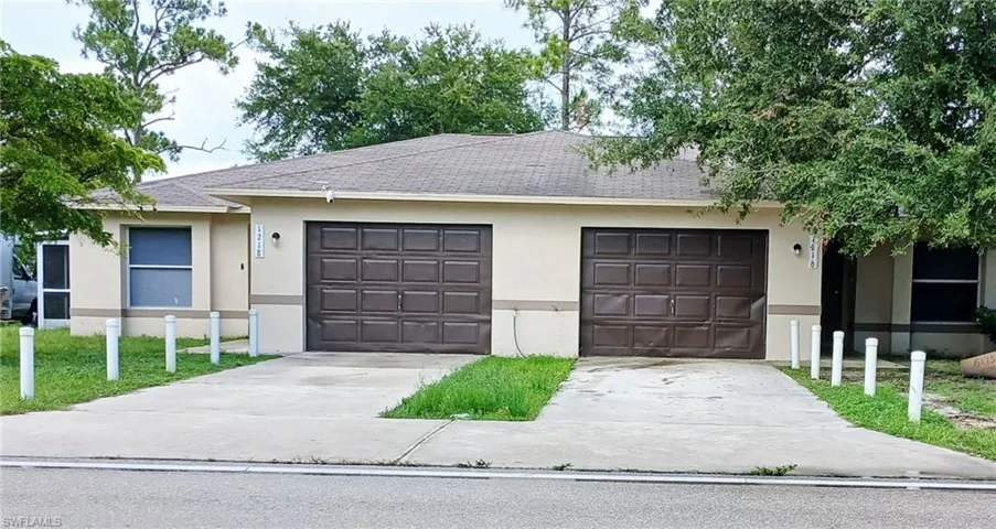 View of front of property featuring roof with shingles, stucco siding, concrete driveway, and an attached garage