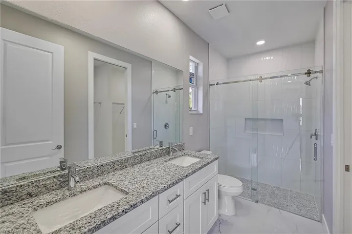 Washroom featuring baseboards, laundry area, electric dryer hookup, and hookup for a washing machine