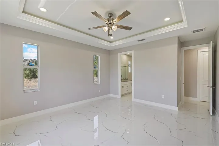 Kitchen with visible vents, baseboards, and stainless steel appliances