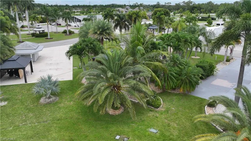 View of home's community featuring a yard and a patio area