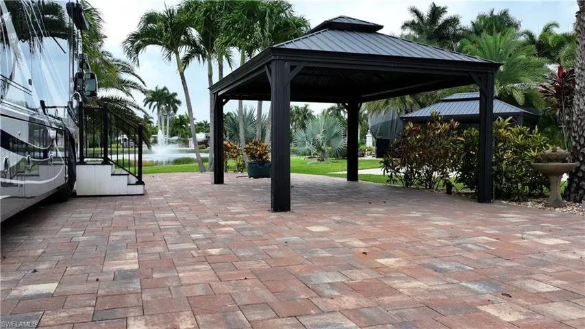 View of home's community with a gazebo and a patio