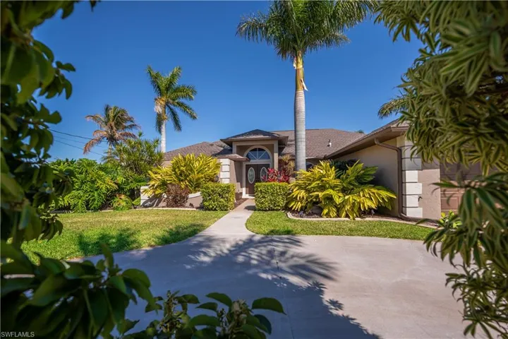 Mediterranean / spanish home with stucco siding and a front lawn