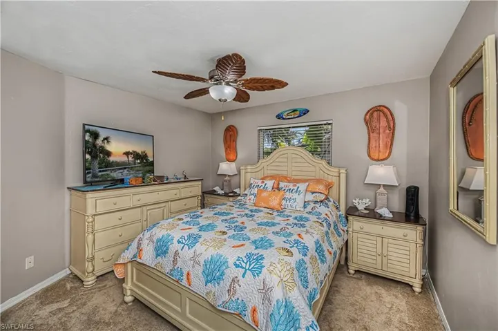Bedroom 3 with a ceiling fan and carpet