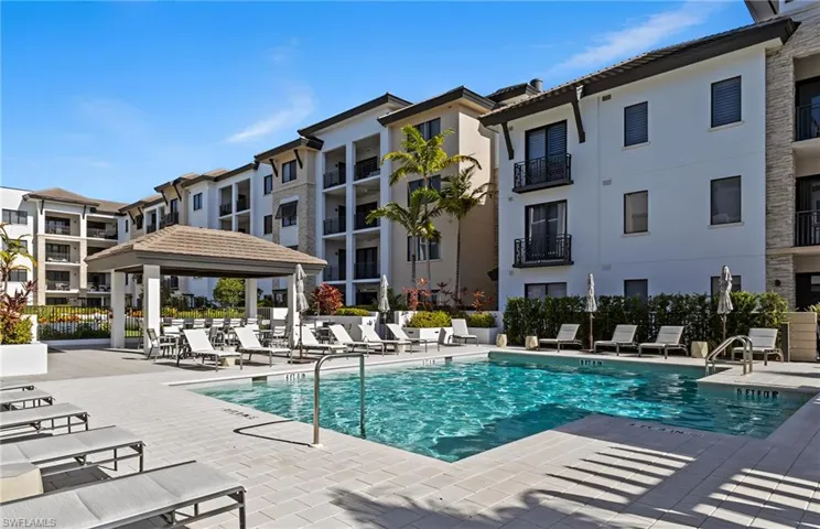 Community pool with a gazebo and a patio area