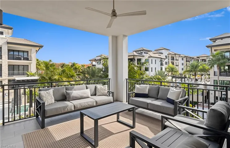 Balcony featuring outdoor lounge area and a ceiling fan