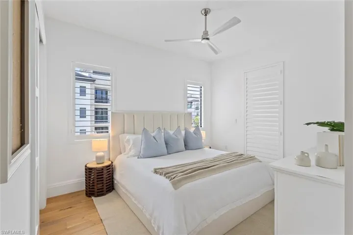 Bedroom featuring light wood-type flooring and ceiling fan