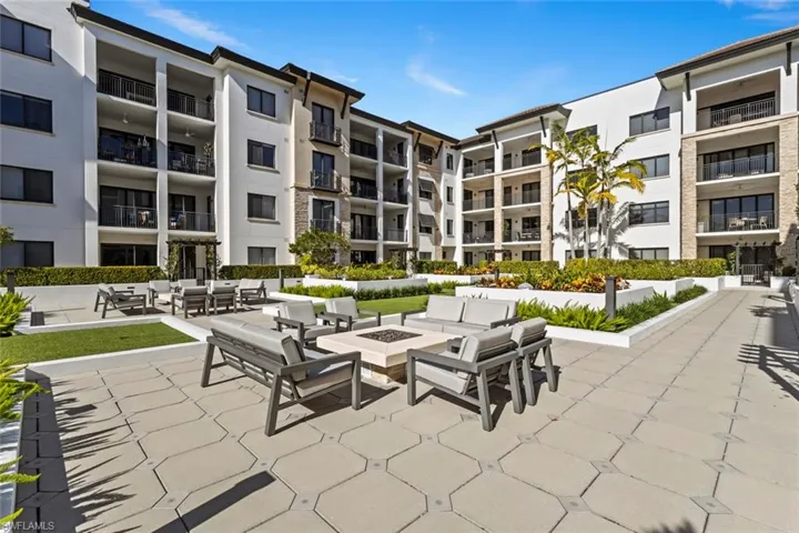 View of patio / terrace featuring an outdoor living space with a fire pit