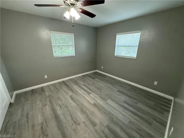 Unfurnished room with light wood-style flooring and ceiling fan