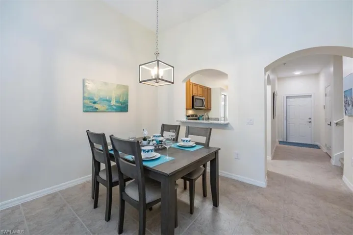 Dining Room with opening to Kitchen and new chandlier
