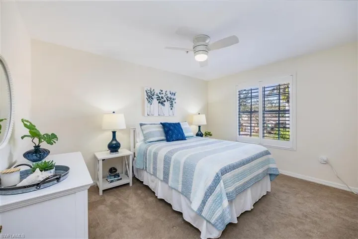 Guest Bedroom w/new ceiling fan and plantation shutters