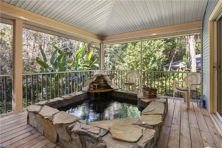 Deck with a garden pond and a jacuzzi
