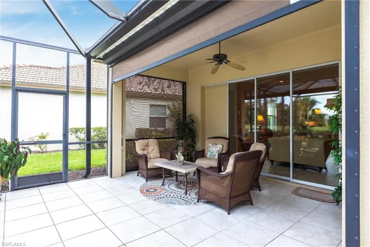Sunroom / solarium with ceiling fan, a patio, and outdoor lounge area