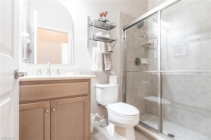 Bathroom with vanity and a shower stall