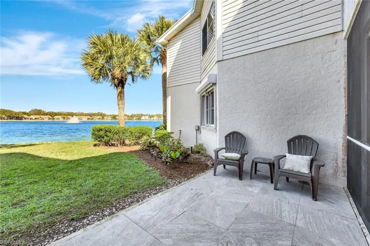 View of patio with a water view