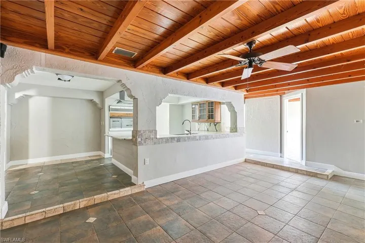 Exposed wood-beam ceiling with an integrated ceiling fan