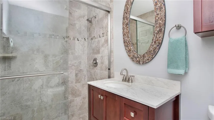 Bathroom featuring vanity and walk in shower