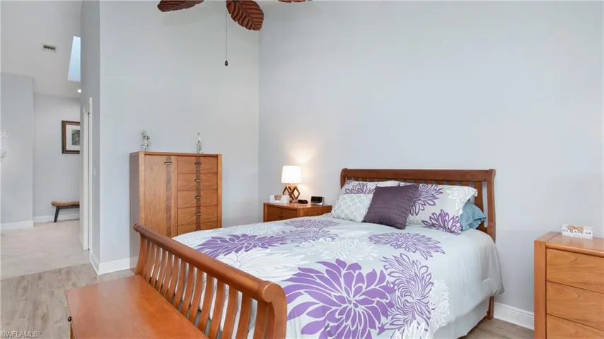 Bedroom featuring ceiling fan and light wood-style tile flooring