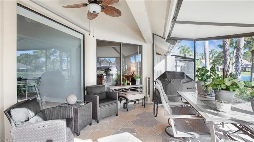 Sunroom / solarium featuring lofted ceiling and ceiling fan