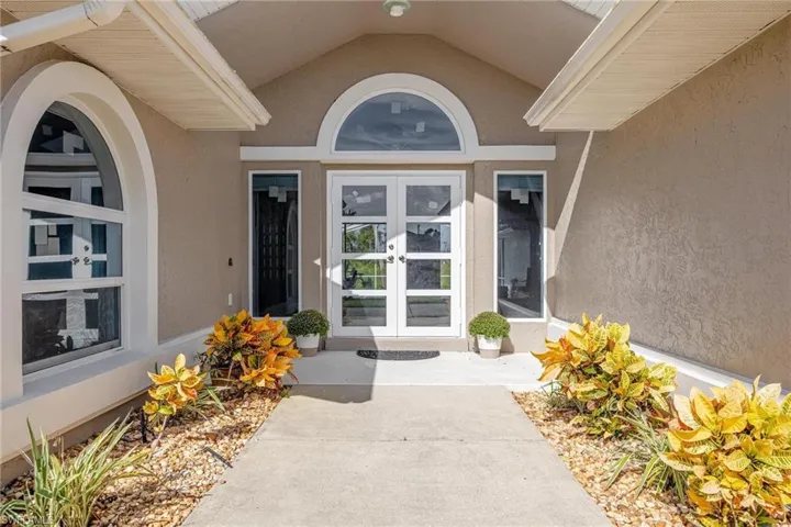 Doorway to property featuring french doors