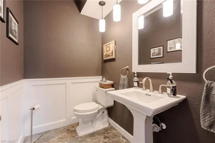 Bathroom featuring toilet and tile patterned floors