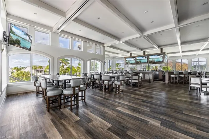 Dining room featuring coffered ceiling and dark wood finished floors