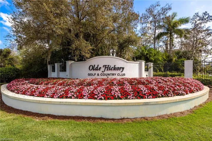 Community / neighborhood sign featuring view of scattered trees