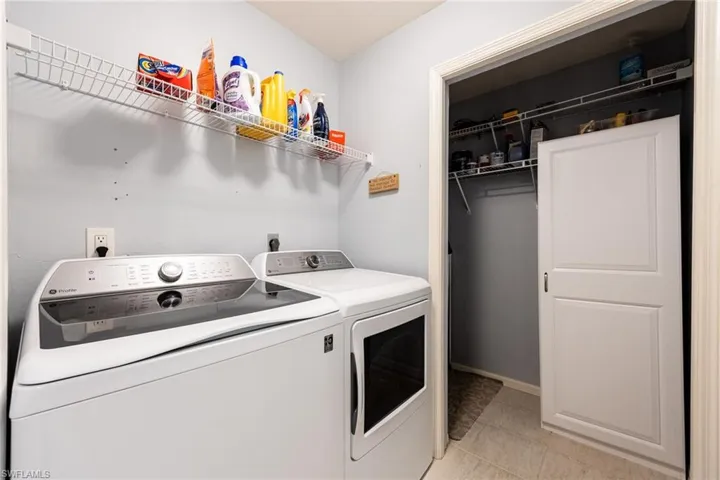 Laundry area with washing machine and clothes dryer