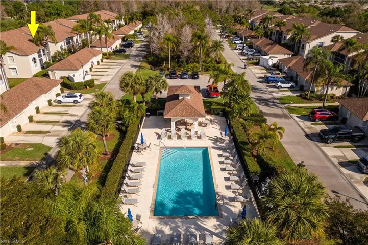Aerial perspective of suburban area featuring a pool area