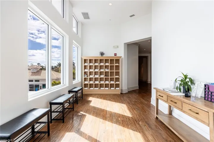 Living area featuring a high ceiling and recessed lighting