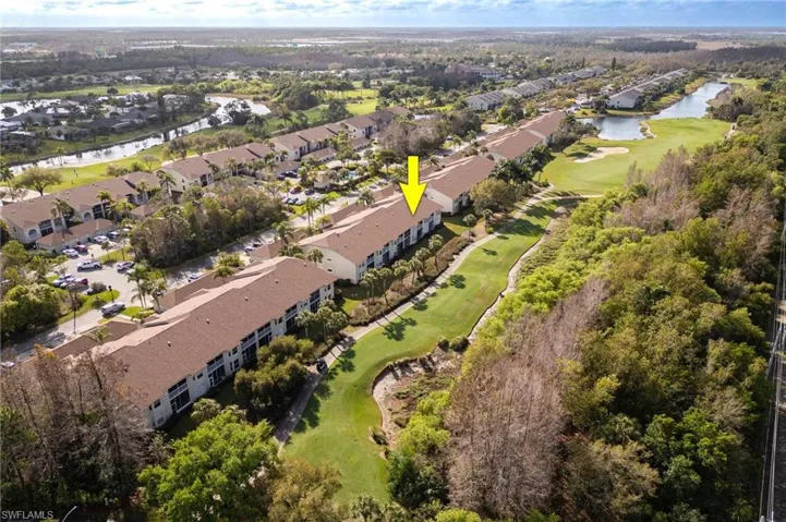 Drone / aerial view of a large body of water and a golf club