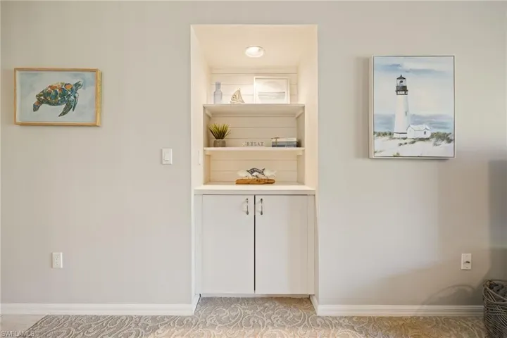 Detailed view of carpet flooring and built in shelves