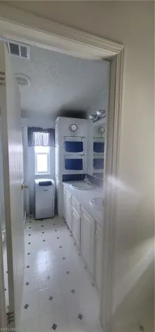 Master Bathroom with dual sinks and shower