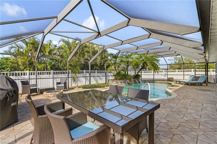 View of patio featuring a fenced in pool and a lanai
