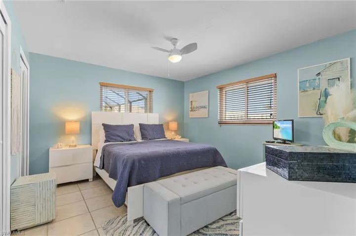 Bedroom featuring ceiling fan and light tile patterned floors